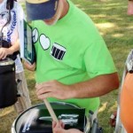Tthom Hannum helps a snare drummer with his grip.